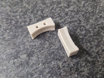 Precision CNC machined polymer components on an inspection granite surface plate